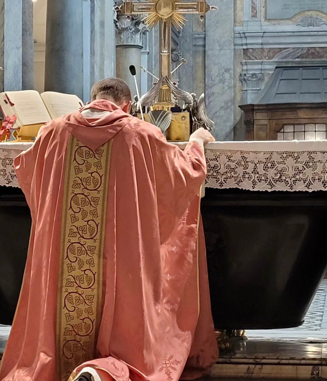 Genuflecting before the relic of the True Cross in the Basilica of Santa Croce in Gerusalemme. Credit: Erick M.